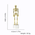 Golden skeleton figurine on silver base with 18cm height and 4.5cm base diameter dimensions - Gold Skeleton