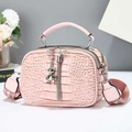 Pink crocodile pattern handbag detail with double zippers and silver bear pendant - Pink