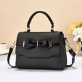 Elegant dark grey woven crossbody bag with black leather bow and silver metal clasp - Black