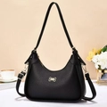 Classic black pebble leather shoulder bag with golden bow hardware and a sleek curved shape - Black