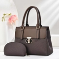 Detail of dark brown tote set with woven texture and gold letter metal buckle on stone surface - Coffee