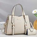 Detail of off-white textured handbag and matching coin purse with golden hardware - Off White
