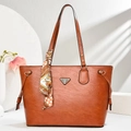 Vintage brown leather tote bag with elegant silk scarf handle and metal logo plaque - Earthy Yellow
