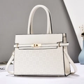 Detail of cream crossbody bag featuring checkered embossed texture and gold metal twist lock - Off White
