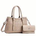 Dettaglio della borsa beige con motivi a cerchi traforati e portafoglio abbinato - Bianco Sporco