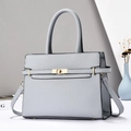 Litchi pattern light blue handbag with gold lock and adjustable shoulder strap - Blue
