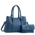 Detail view of dark blue lychee pattern tote bag with matching envelope wallet set - Blue