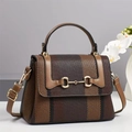 Close-up of contrast stripe canvas bag with leather trim and gold horsebit detail - Apricot