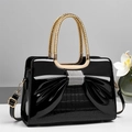 Glossy black patent leather handbag with rhinestone bow and gold handles - Black