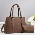 Close-up of brown litchi pattern leather tote bag and matching long flap wallet with gold hardware - Khaki
