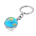 Macro detail of a glass globe keychain with world map print and silver metal ring - Brown Transparent Minimalist Style (JY004125-3)