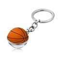 Macro view of a basketball keychain with a silver metal frame and a glossy orange dome charm - Jy004120-5