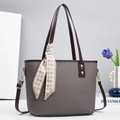 Gray lychee leather bucket tote bag with brown handles and a stylish houndstooth scarf - Gray