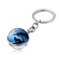 Detail of howling wolf silhouette under blue moon on a glass ball keychain pendant - Howling Wolf Blue Tree Night (JY004131-3)