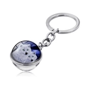 Close-up of howling wolf art glass cabochon pendant with silver metal keychain ring - Two White Wolves Night (JY004131-8)
