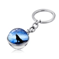 Macro shot of silver howling wolf pendant with double-sided glass orb on white background - Forest Blue Night Howl (JY004131-9)
