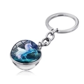 Detailed view of the double-sided glass sphere keychain with a flying blue unicorn design - Deep Blue Fantasy Unicorn (JY004210-6)