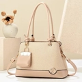 Detail of apricot woven handbag featuring a mini bag charm and gold metal logo - 24cmx11cmx17cm / Light Khaki