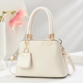 Minimalist beige woven texture tote bag with gold V logo and mini charm pendant - Off White