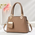 Detailed view of brown trapezoidal handbag with textured fabric and V logo hardware - Dark Khaki