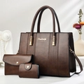 Three-piece brown faux leather tote set with shoulder bag and clutch in an elegant setting - Coffee
