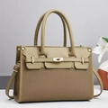 Detailed view of luxury tote with gold twist lock and litchi texture leather finish - Olive Green