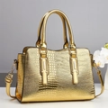 Golden crocodile embossed large shoulder bag with sturdy handles and metallic finish - Gold