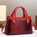 Elegant red crocodile embossed patent leather handbag with gold hardware and shoulder strap - L30 W12 H18 / Red