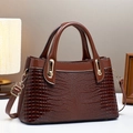 Elegant brown crocodile pattern handbag with gold hardware and adjustable strap - L30 W12 H18 / Coffee
