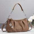 Detail of brown woven cloud bag showing metallic chain strap and gold sphere charms - Coffee