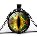 Detailed view of green dragon eye glass cabochon pendant on a black alloy chain - Yellow Green Dragon Eye Style (JY005360-2)