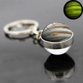 Detail of Jupiter planet glass ball keychain with green luminous glow in the dark effect - Jupiter