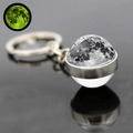 Detailed view of moon glass ball keychain with glowing effect on black background - Moon (JY005253-1)