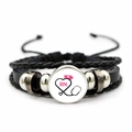Detailed view of handmade multilayer leather bracelet with RN nurse theme glass dome charm - RN Pink Nurse Hat Pattern (JY005480-6)