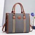 Borsa tote in tela grigia con finiture in pelle marrone e tracolla a righe in studio - Nero