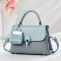 Light blue chic handbag with mixed leather texture and elegant metal ring buckle - Blue
