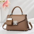 Detail of a brown leather and woven handbag featuring a silver buckle and mini bag charm - Dark Khaki