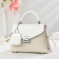 Elegant woven beige and white crossbody bag with geometric metal lock and mini charm - Off White