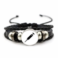 Detailed close-up of handmade leather bracelet with medical syringe glass dome pendant - Black Syringe (JY005480-11)