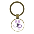 Detail of antique bronze RN nurse keychain with glass cabochon and medical symbols - RN Registered Nurse Purple Icon (JY005474-4)