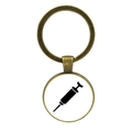 Macro detail of bronze alloy keychain featuring a glass cabochon with syringe medical icon - Black Syringe Silhouette (JY005474-11)