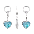 Detail of three heart-shaped keychains with blue butterfly designs in silver frames - Blue Butterfly Style (JY005591-3)