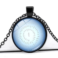 Macro shot of circular vintage pendant with Six-Word Mantra script on blue background - Light Blue Gradient Spiral Scripture (JY005539-5)
