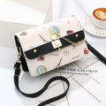 Paris themed printed crossbody bag with Eiffel Tower patterns and gold cat lock detail - Black (With Two Straps)