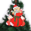 Christmas bear ornament in red gift bag hanging on festive tree decoration - Christmas Bear Pendant
