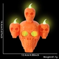 Lampada a candela LED arancione scheletro di Halloween con quattro teschi e misure - Arancione