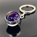 Detailed macro view of Taurus constellation glowing inside a glass ball keychain pendant - Taurus