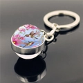 Hummingbird glass ball keychain with pink flowers on a polished silver metal ring - Light Blue Background Pink Flower Hummingbird (XSWX2271-8)