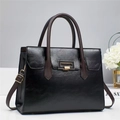 Elegant black faux leather tote bag with brown handles and a gold metal buckle detail - 29x12x22cm / Black