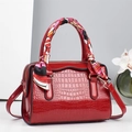 Glossy red crocodile texture handbag with silk scarf handle and gold hardware detail - Red